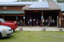 Customers touring the winery production area and sample tasting Conneaut Cellars Winery wines.