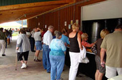 Customers enjoying wine and music at the Conneaut Cellars Winery summer picnic event.
